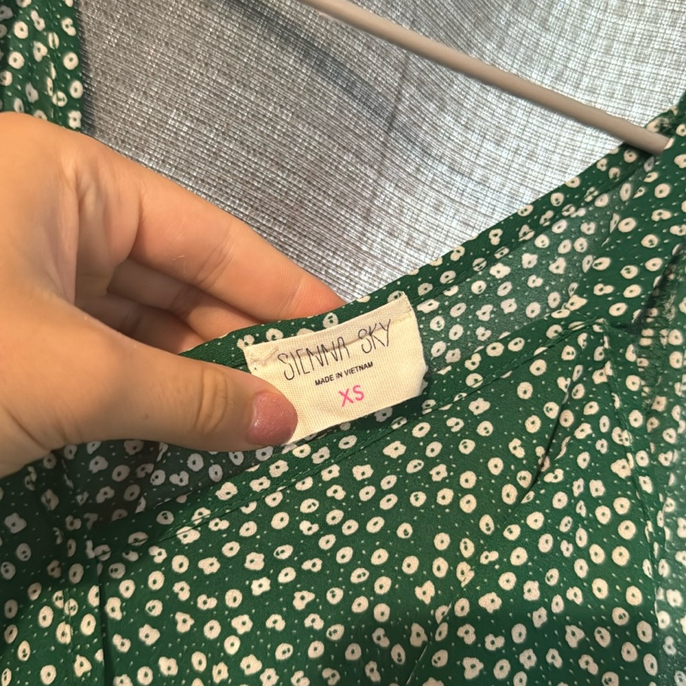 Green dress with white semi floral print. Size XS. Semi off the shoulder cut.